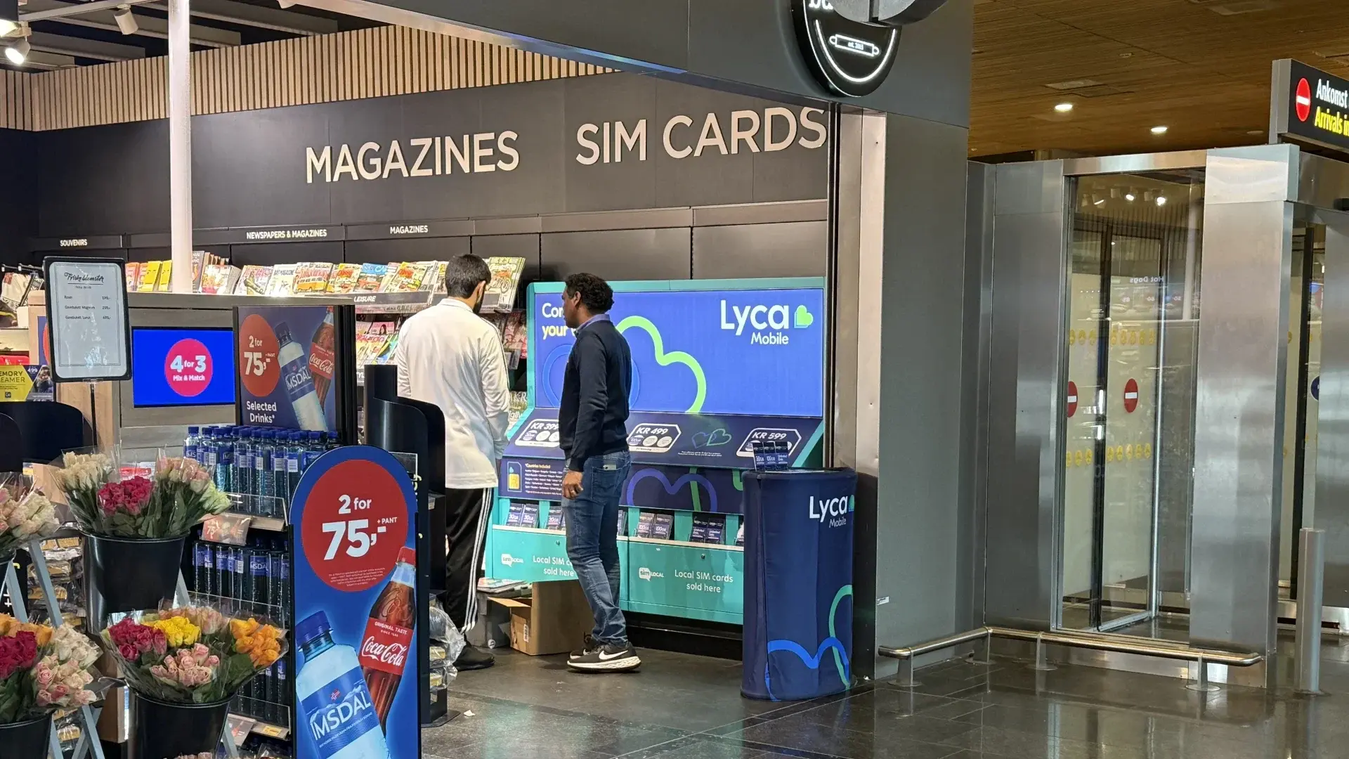 Sim Local counter selling Lyca Mobile prepaid SIM cards inside the WH Smith shop at Oslo Gardermoen Airport arrivals